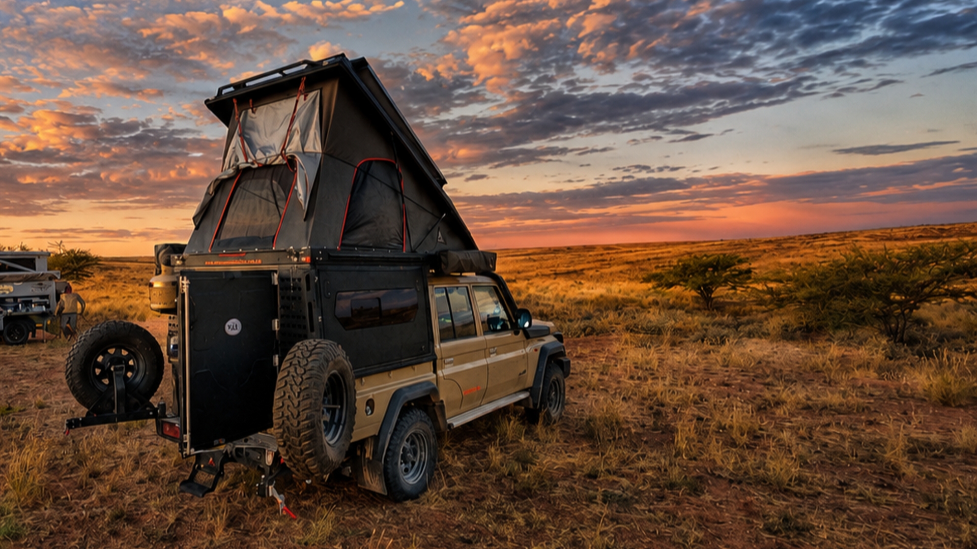 Camping-equipped 4x4 beneath an evening sky
