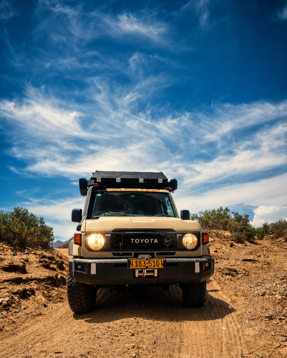 4x4 vehicle seen from the front on a dry track